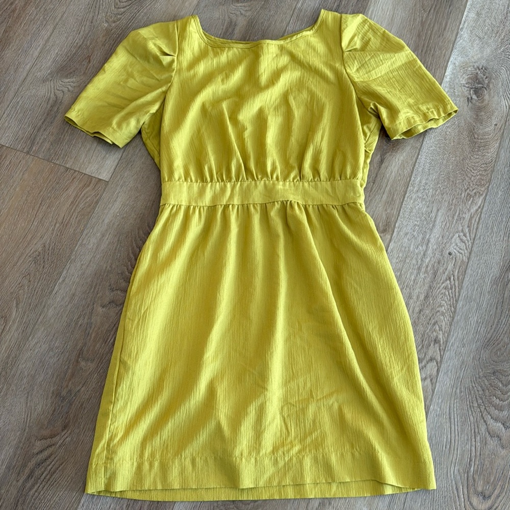 Chartreuse BCBG generation dress. Side zip. Lace up back detail. Pockets